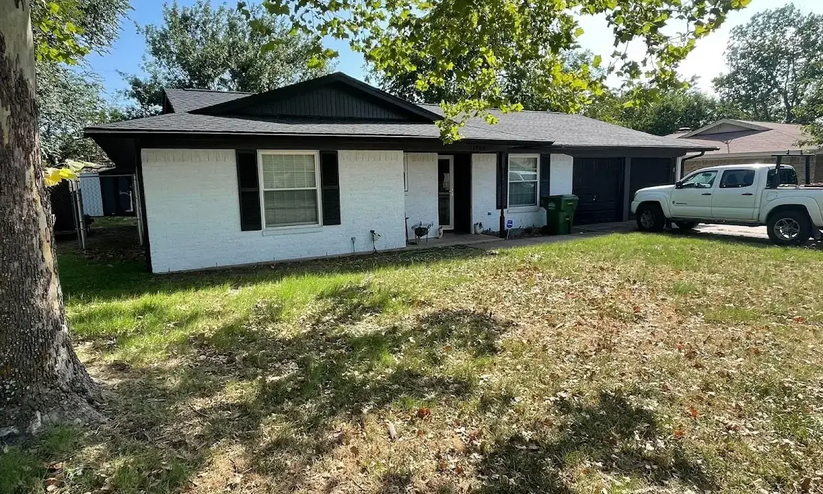 Professional roofing crew working on a residential roof in Halawa